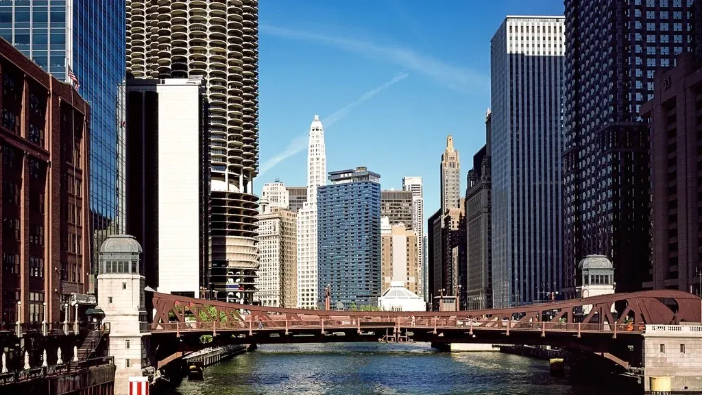 A bascule bridge over the Chicago River framed by Loop office towers