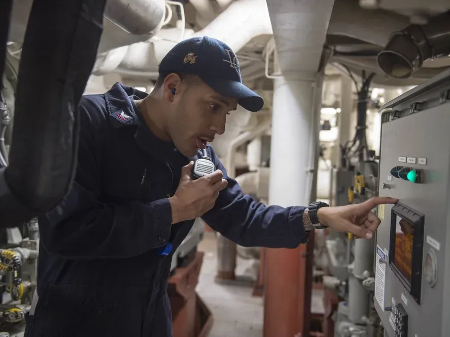 Technician working at building control equipment