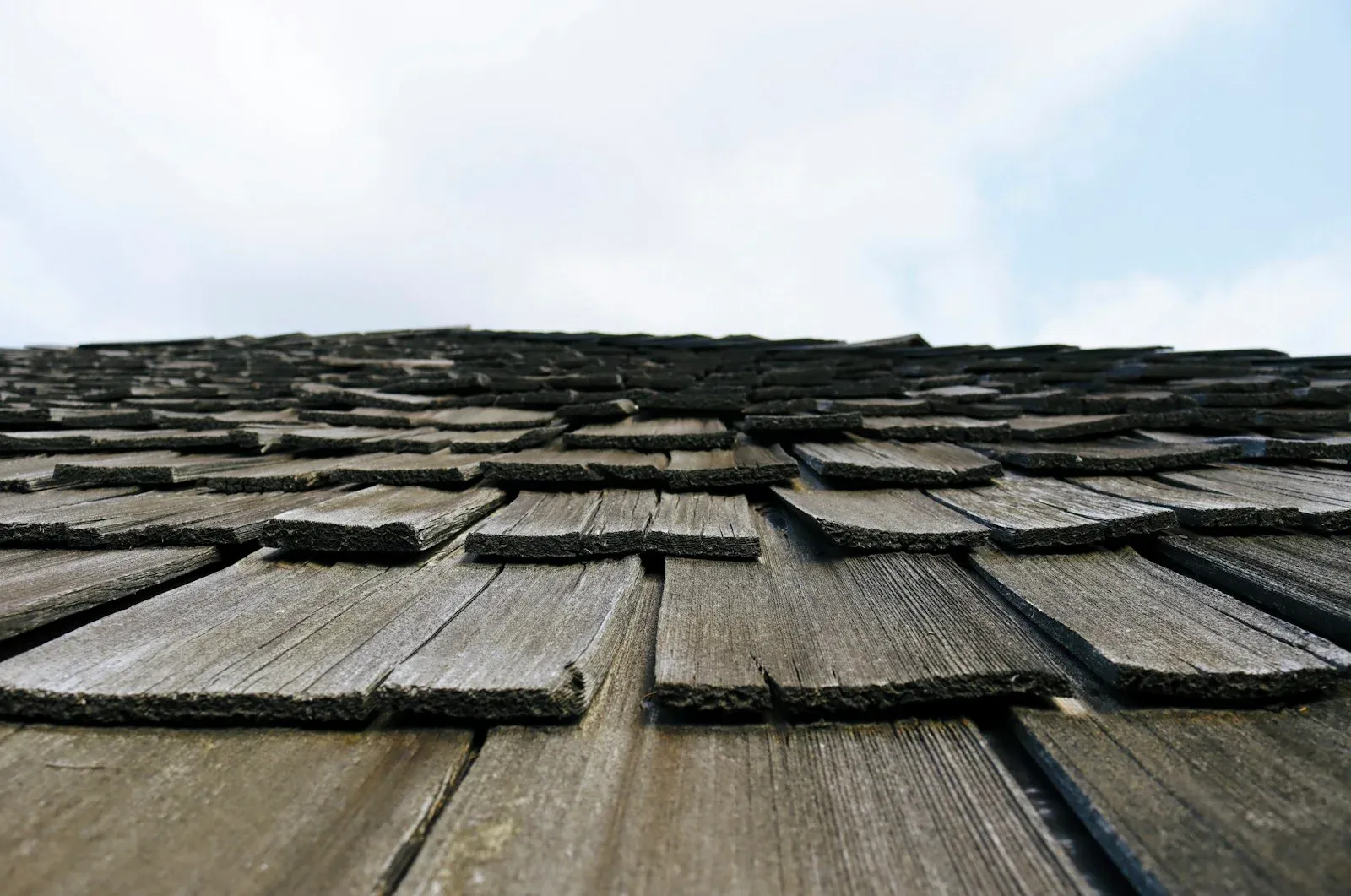 Close view of weathered wood roof shingles